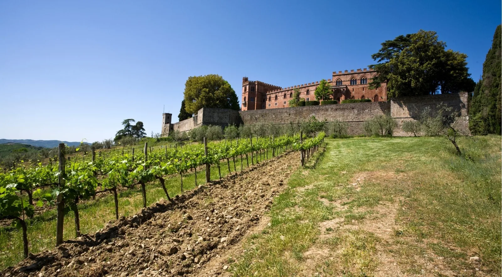 Castello di Brolio, the fortified Ricasoli castle above the vineyards of Gaiole in Chianti — one of the most beautiful wine estates in Tuscany